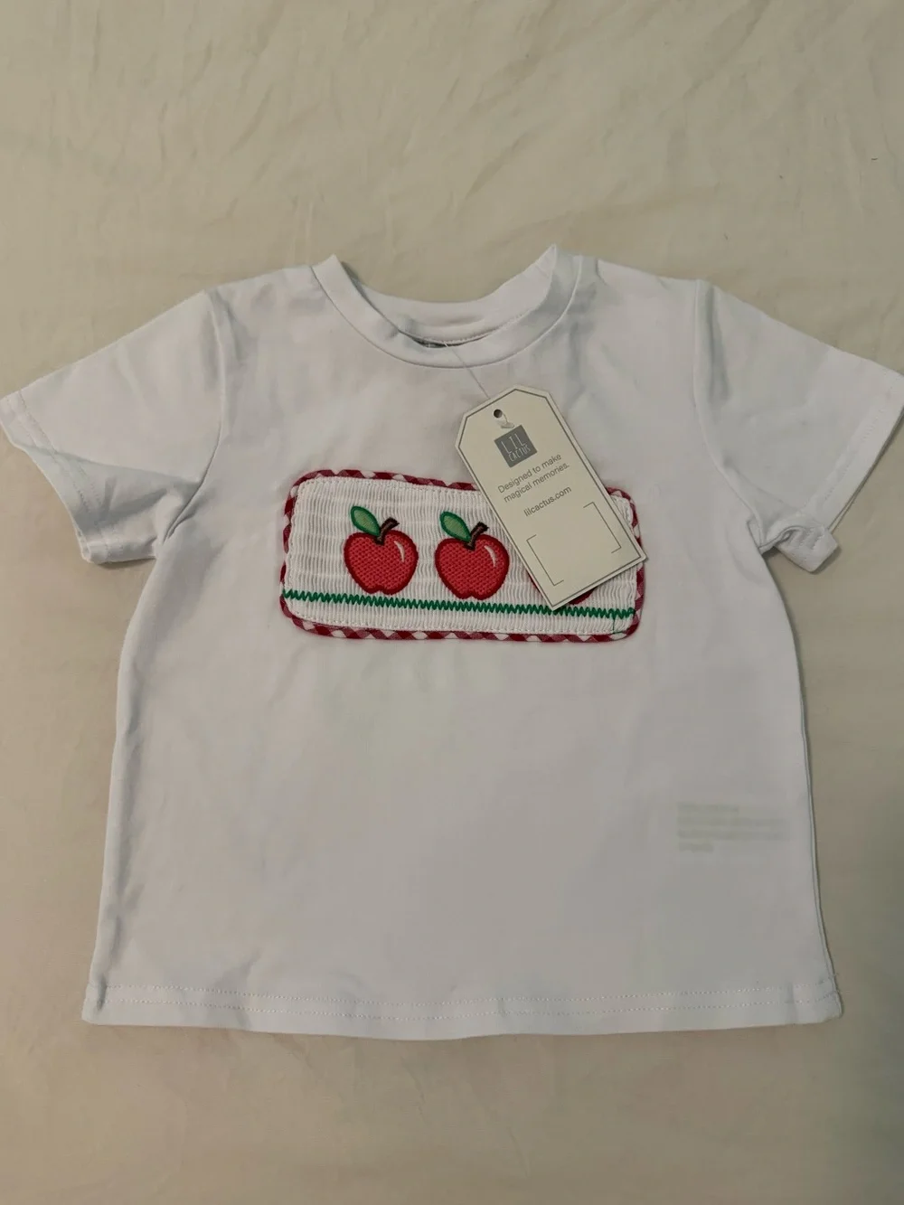 Embroidered set. Red apples and gingham red and white short. So cute!